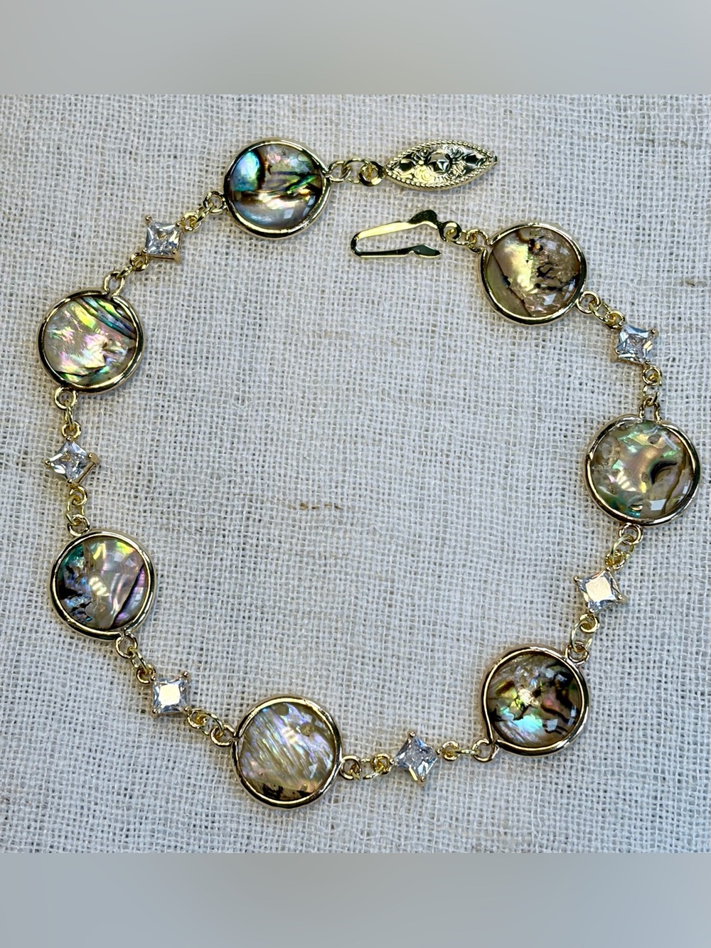 GIFT.Abalone iridescent round shell bracelet,clear CZ spacers,18K gold plated.7”